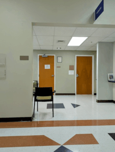 Modern clinic hallway (representative of improved facilities). Many experts argue Canada should allow similar private or mixed clinics to handle publicly-funded care, as in Australia’s health system